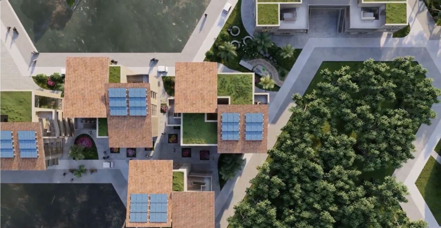 Top view of solar-powered, green-roofed residential buildings.