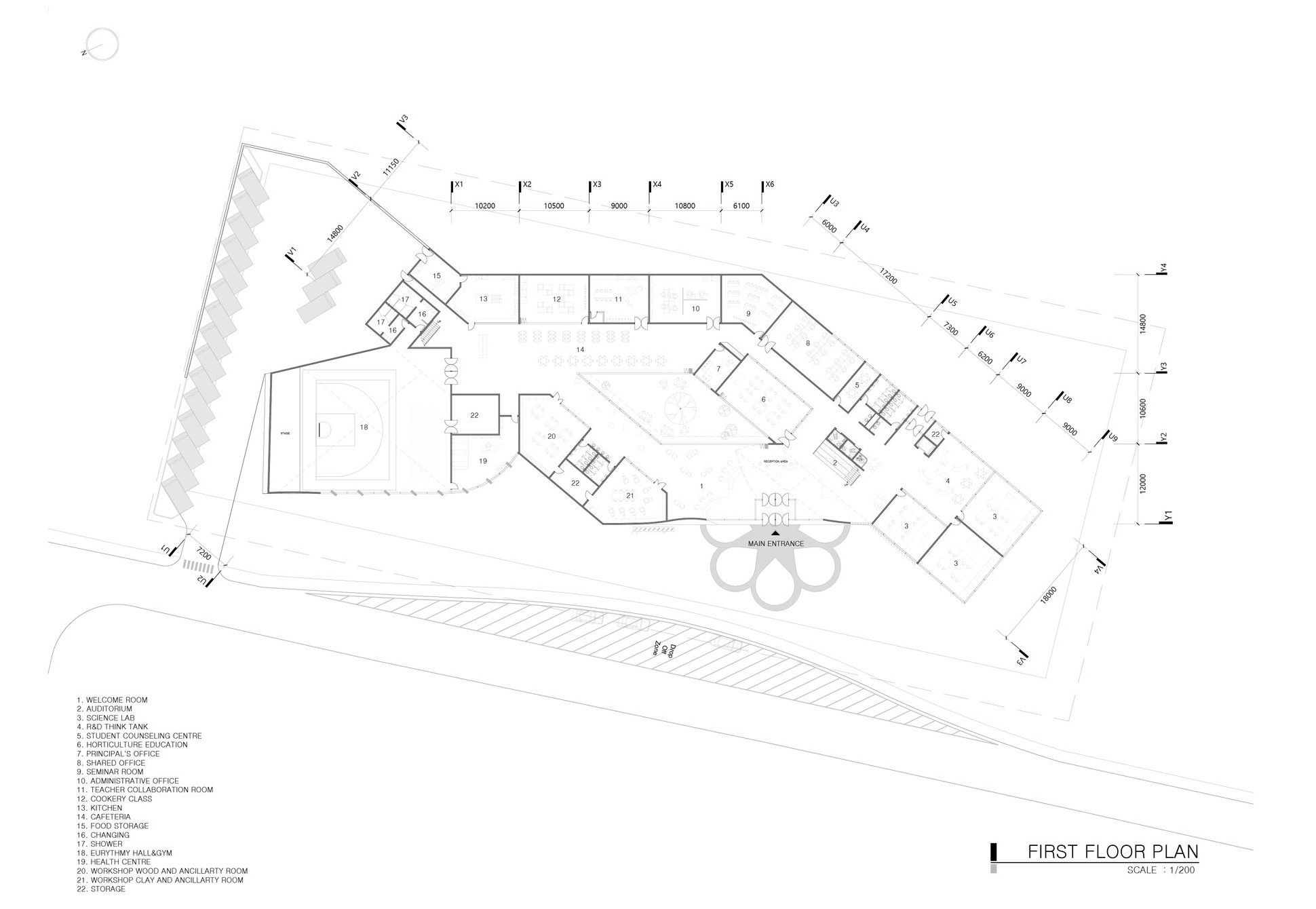 Harmony School's first-floor plan: classrooms, workshops, and central courtyard.