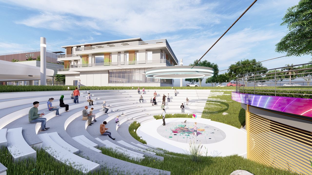 Modern amphitheater with seating, art, and surrounding greenery.