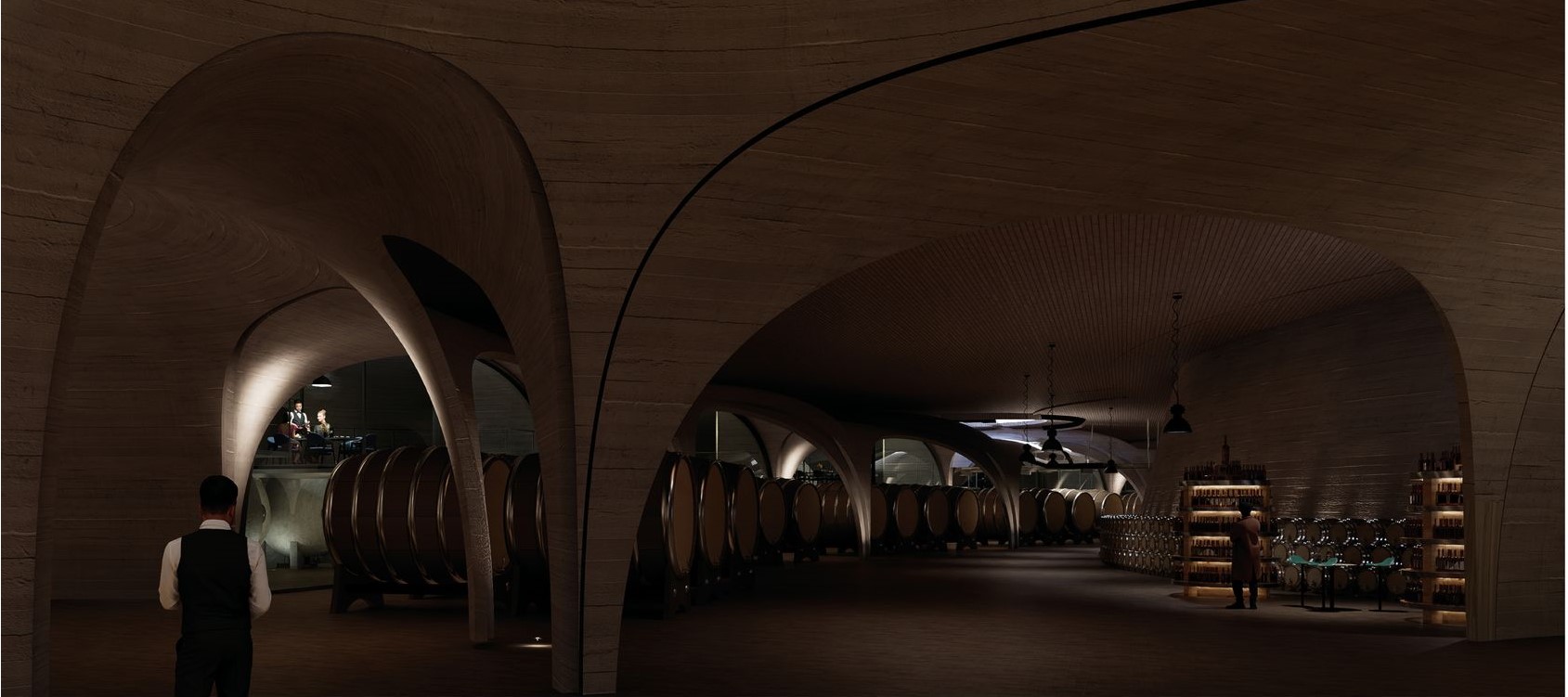 Underground wine cellar with arching concrete ceilings.