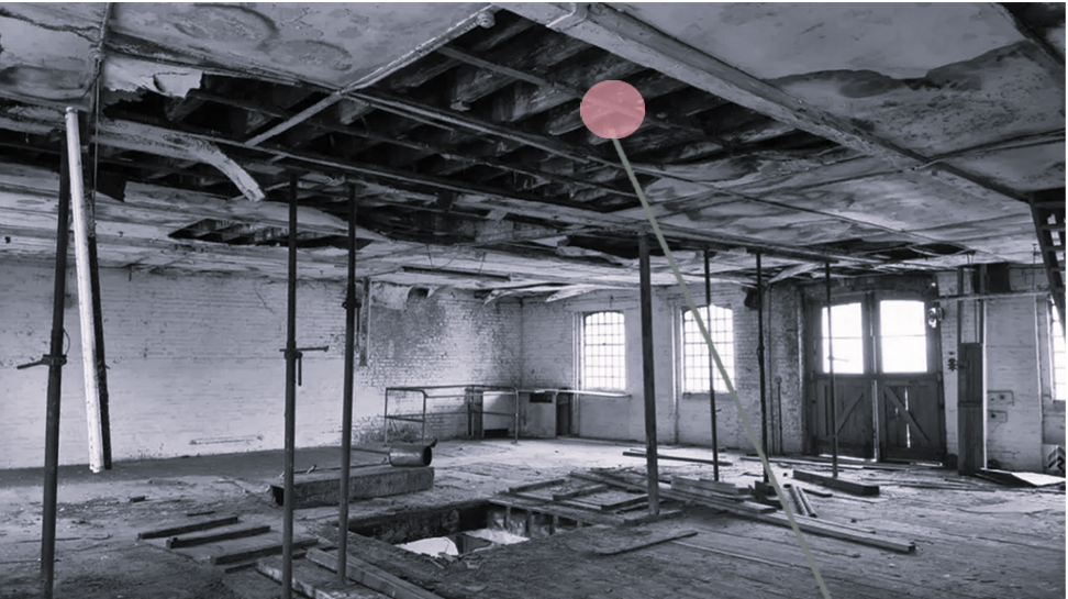 The historic warehouse before its transformation – a relic of the past, ready to be reimagined with sustainability in mind.