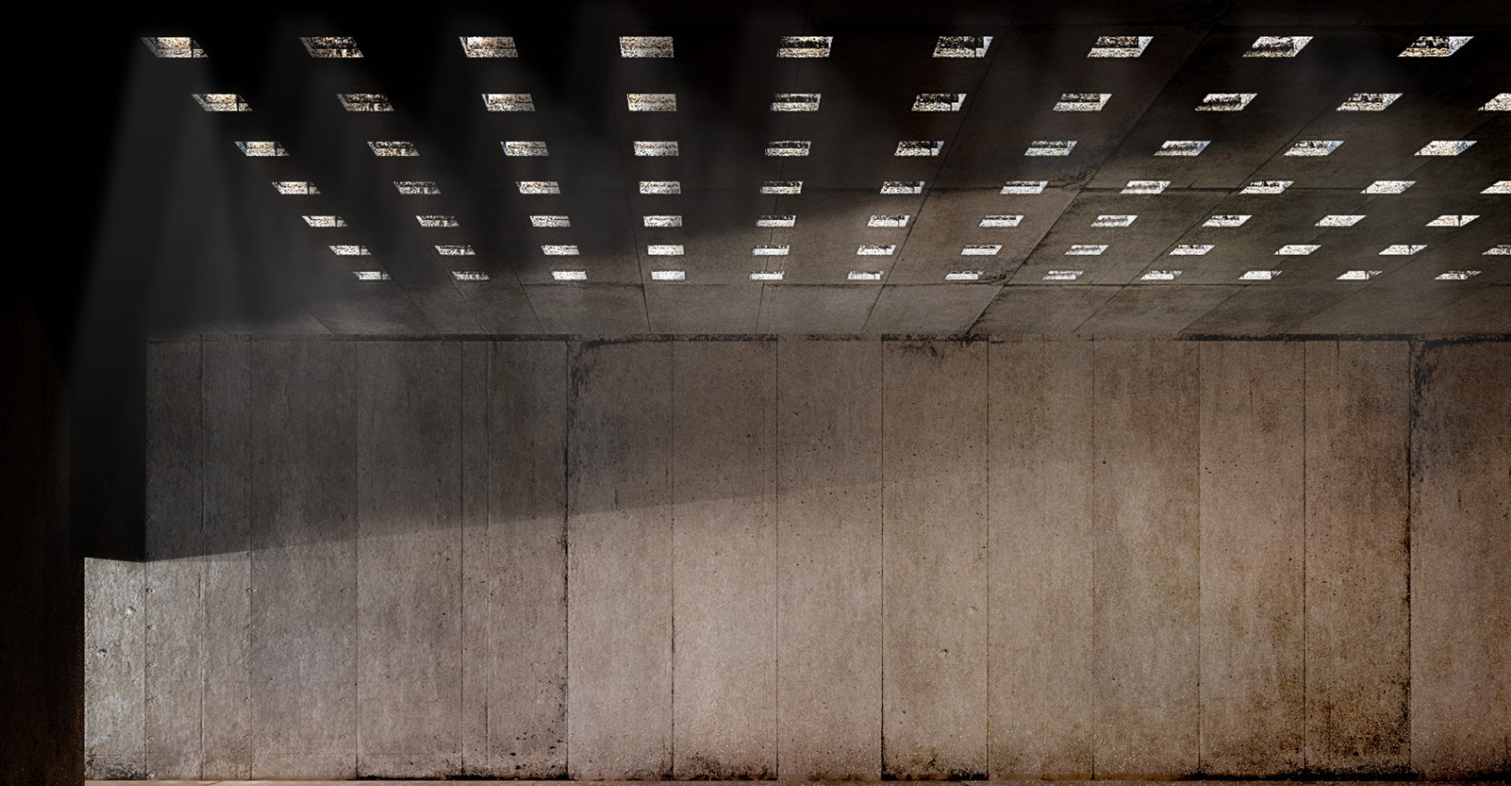 A dramatic play of light through perforated ceilings in the Museum of Memory, symbolizing hope and resilience.