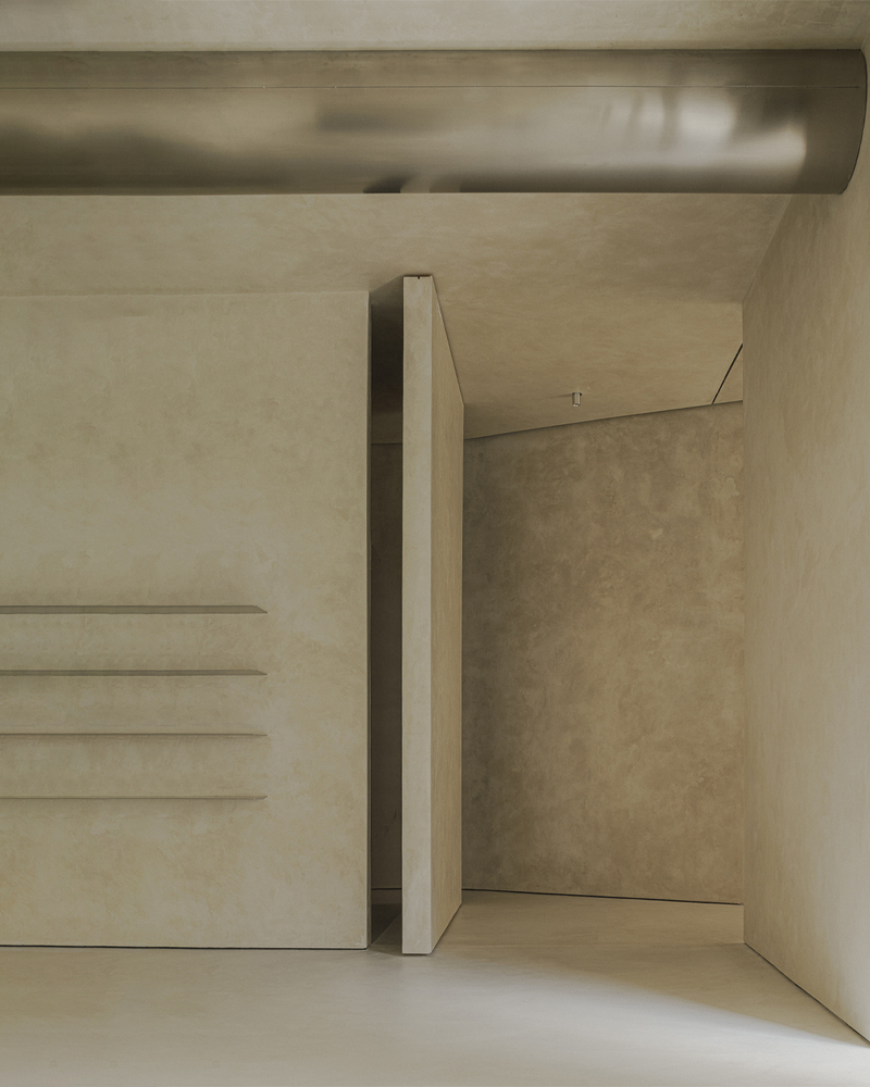 Concrete staircase with integrated floating steps and a slender column beside a narrow passage