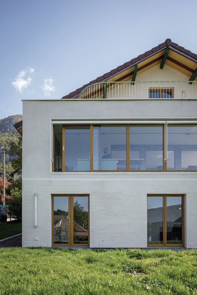 Garden side vertical: white brick and timber window detail, lawn approach