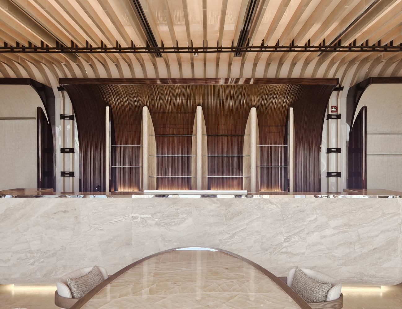 Nalu ground floor: dark timber wave-form columns rising to a slatted ceiling, marble counter, warm lighting