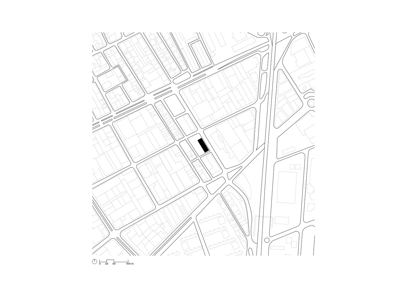 Site plan: building footprint highlighted in black within the surrounding street grid of L'Hospitalet de Llobregat