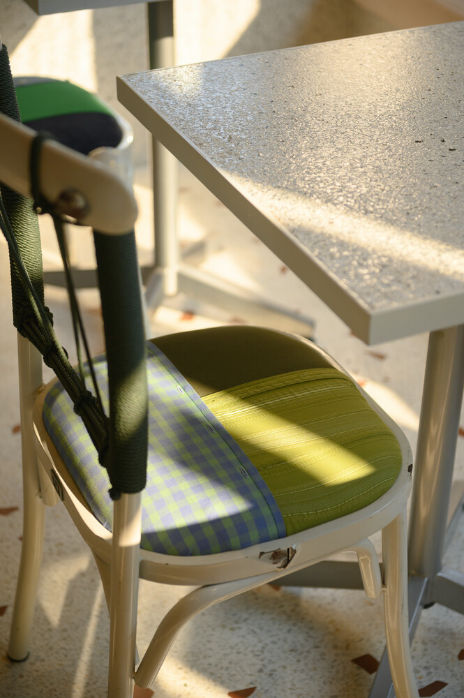 Refurbished chair: white metal frame with patchwork fabric seat cushion in green and check patterns