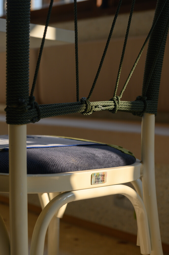 Refurbished chair: white bent-wood frame with dark woven seat and cord-wrapped backrest