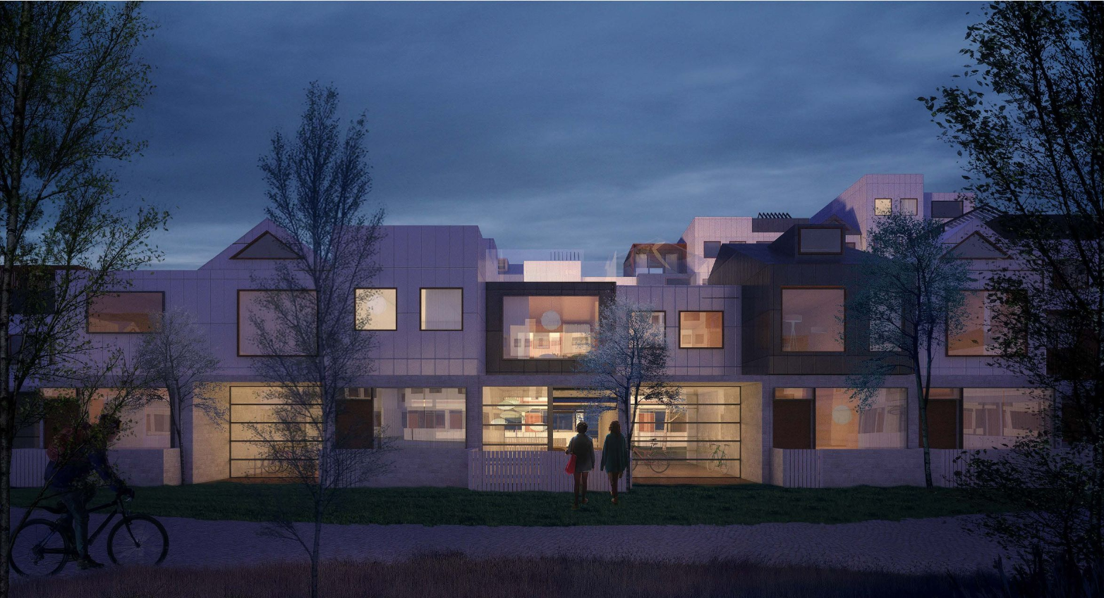 Street-facing elevation at night: warmly lit windows in a composition of varied rooflines and facade materials, with a cyclist, a couple, and trees in the foreground