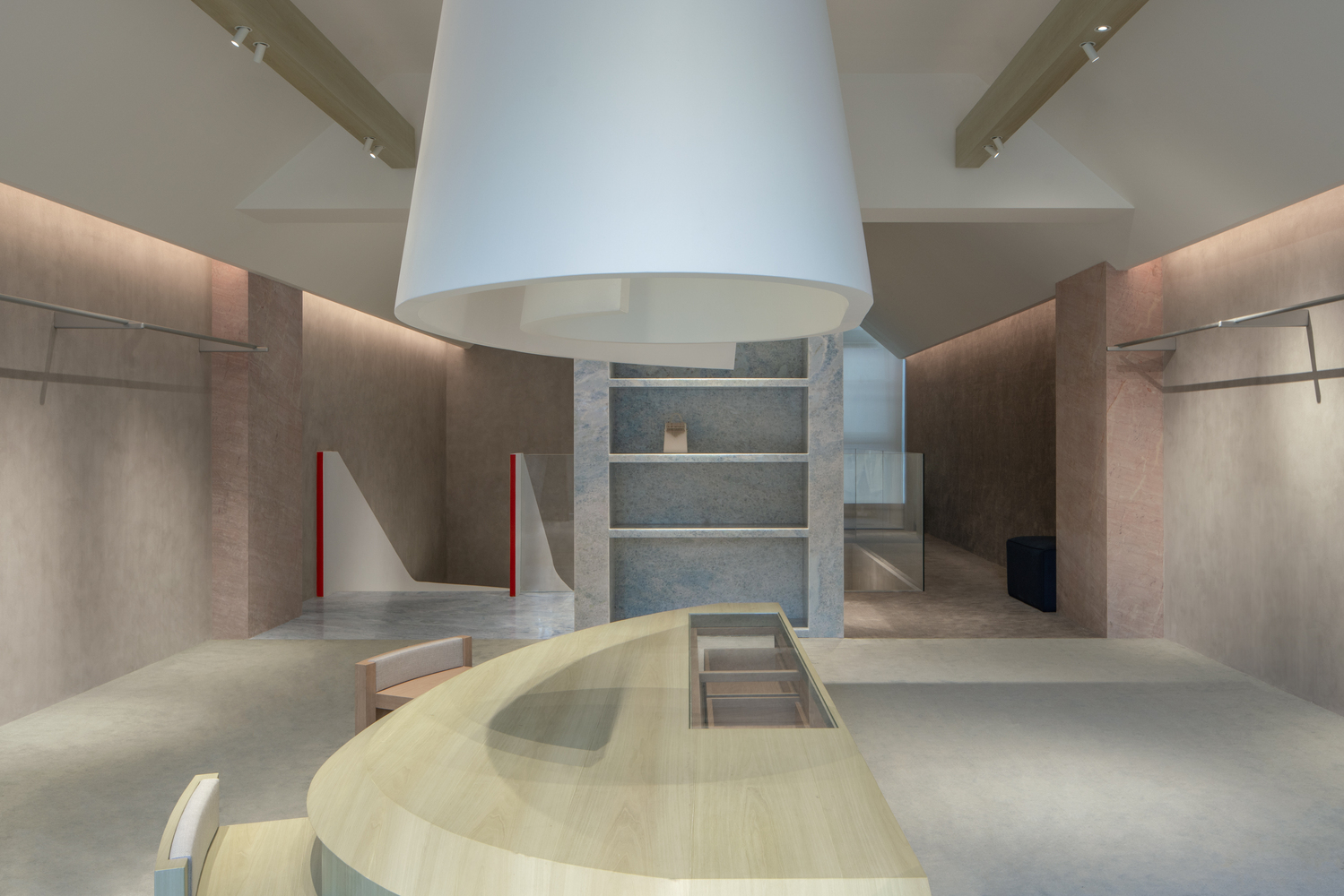 Central white hood above curved timber platform with stone shelving visible in background alcove
