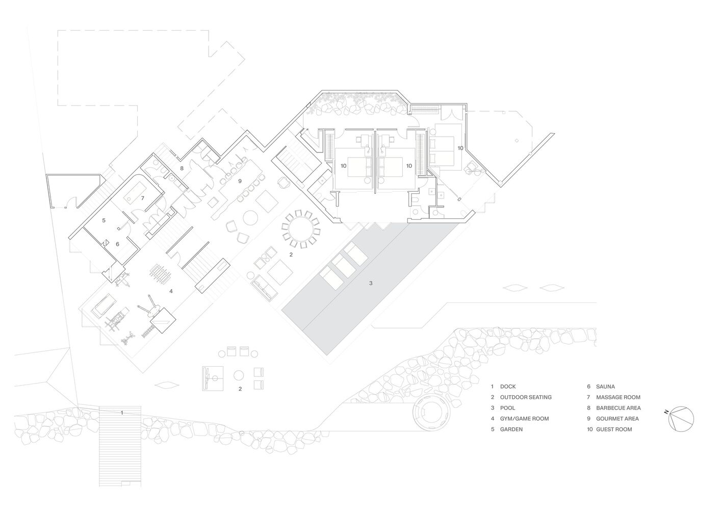 Floor plan drawing showing angular rooms arranged around a central courtyard with pool