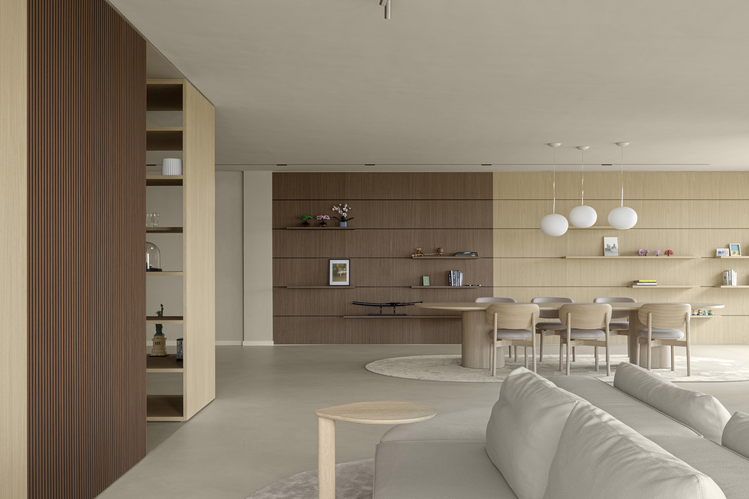Open-plan living area with wood-paneled walls, built-in shelving, and a dining zone under pendant lights