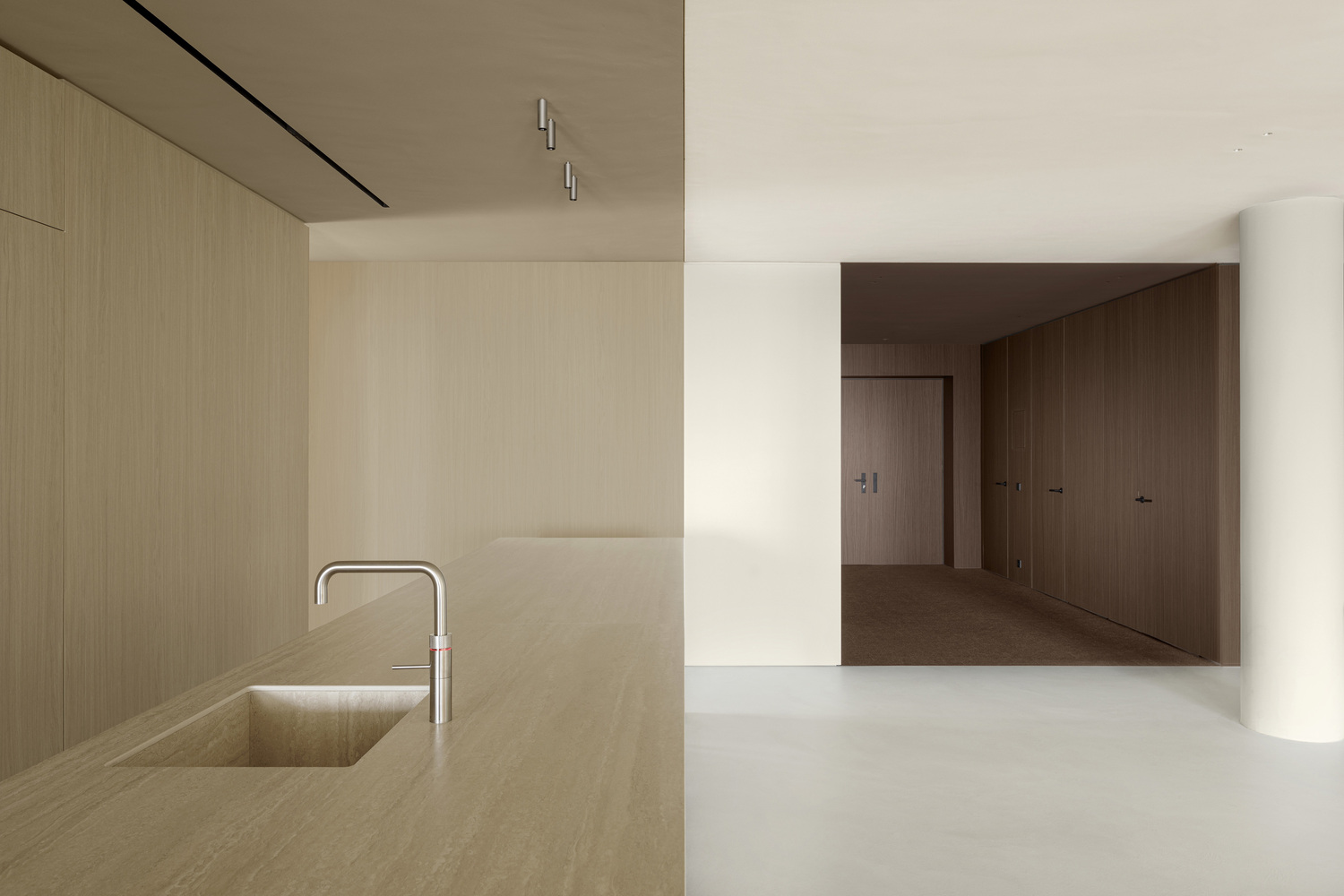 Light wood-paneled wall meeting a darker timber door at a white corner