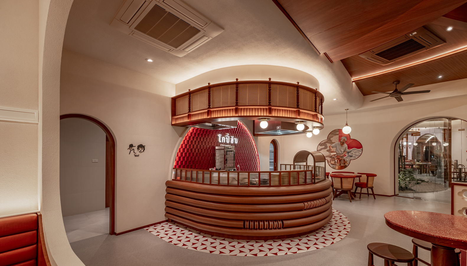 Circular service counter with horizontal timber slats beneath a suspended timber ring and coffered ceiling