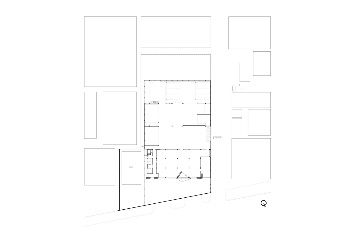 Site plan drawing showing the angled building footprint within the surrounding urban blocks