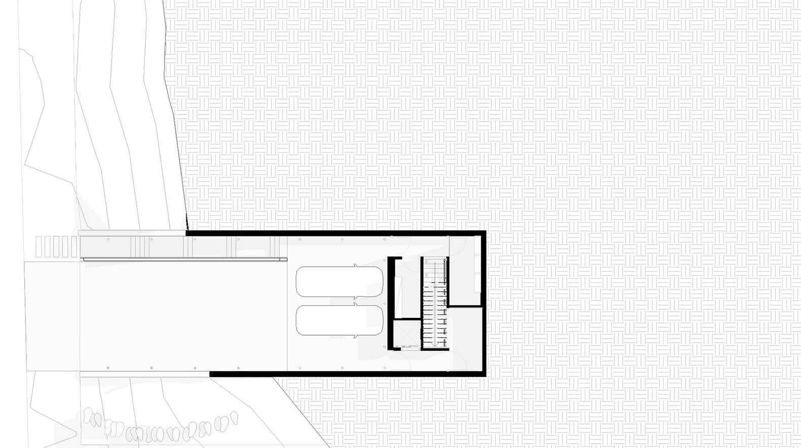 Floor plan showing a rectangular volume with interior staircase and adjacent open terrace