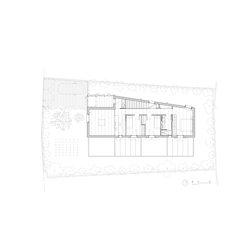 Upper floor plan drawing revealing bedroom spaces and the sloped roof structure above terrace