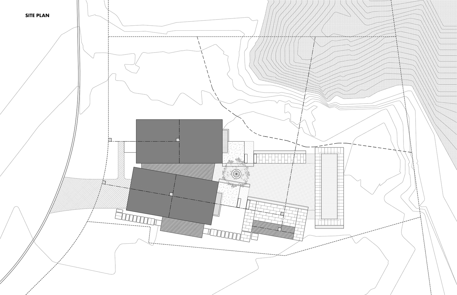 Site plan drawing indicating building footprints on a sloped lot with contour lines