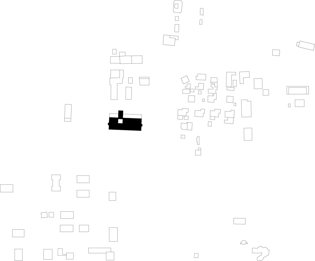 Site plan drawing showing the building footprint in black among surrounding neighborhood structures