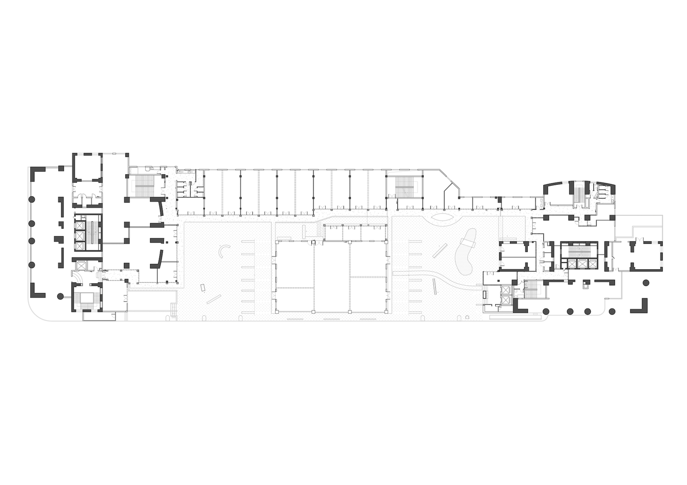 Floor plan drawing showing a long rectangular structure with flanking wings and a large central courtyard space