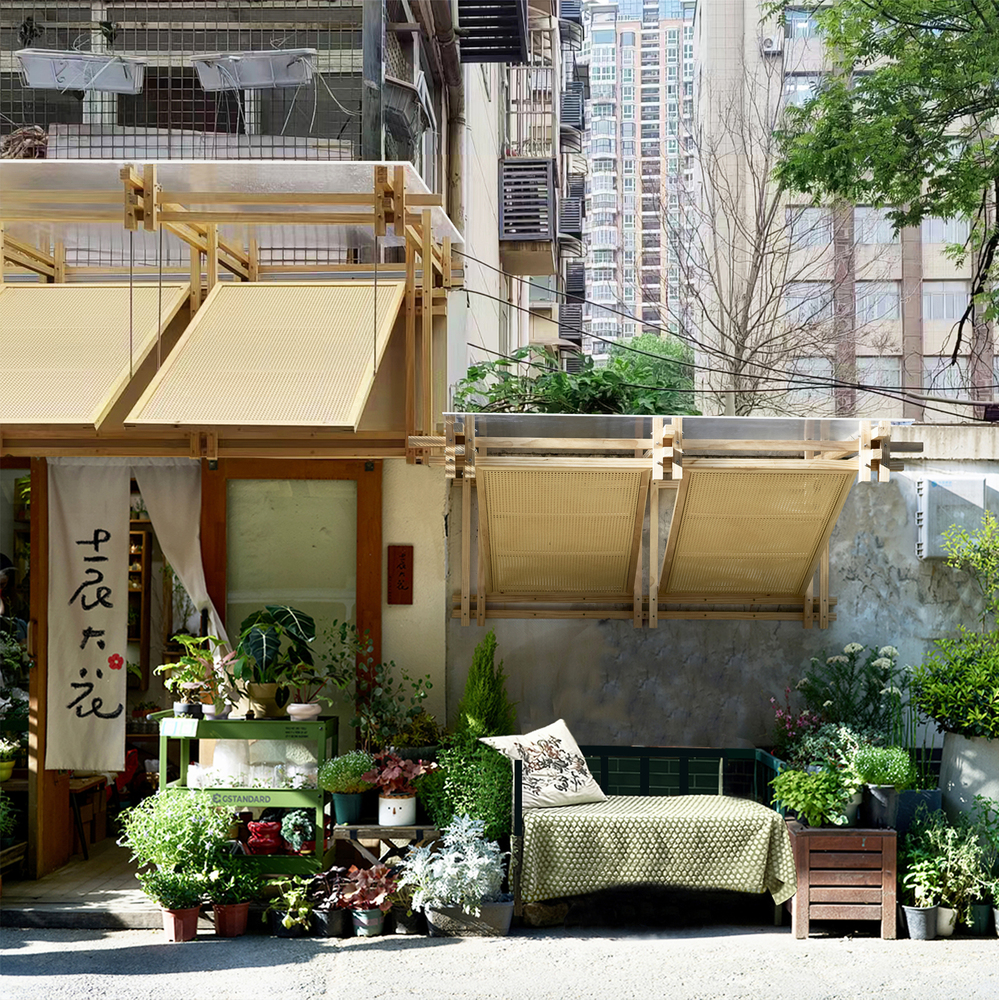 Street-level view of the timber-framed storefront with retractable awnings and potted plants on the sidewalk
