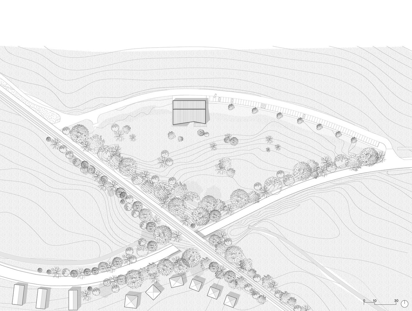 Site plan drawing showing a building and parking area surrounded by contour lines and landscaping