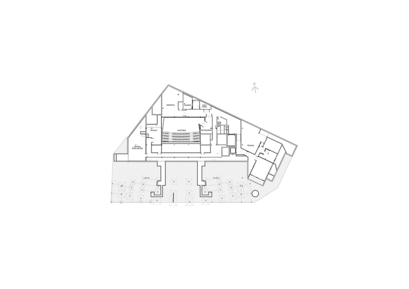 Floor plan showing a triangular footprint with paired courtyards flanking a central auditorium space