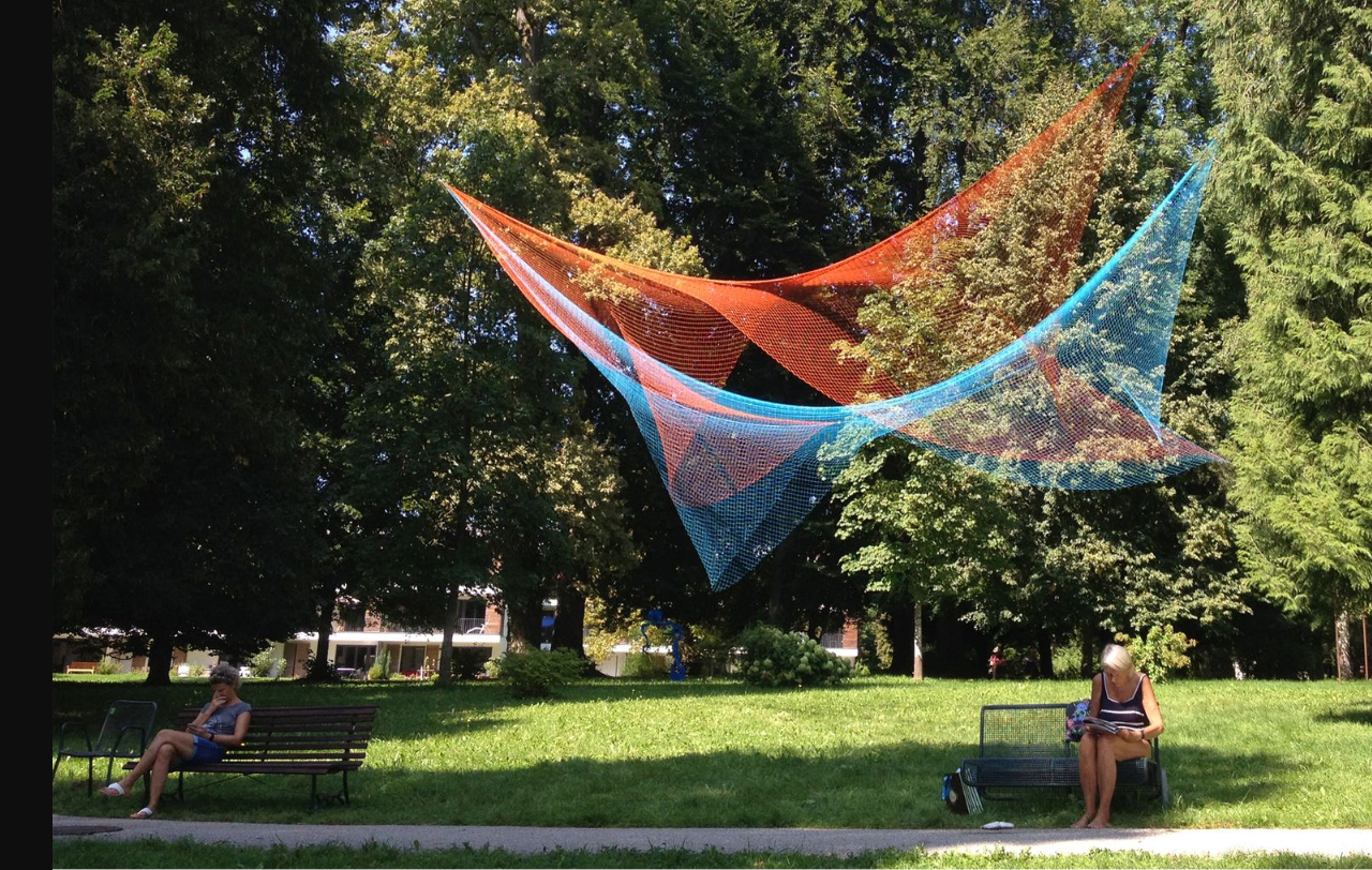 Daylight Harmony: Vibrant nets create a dynamic contrast against lush greenery.