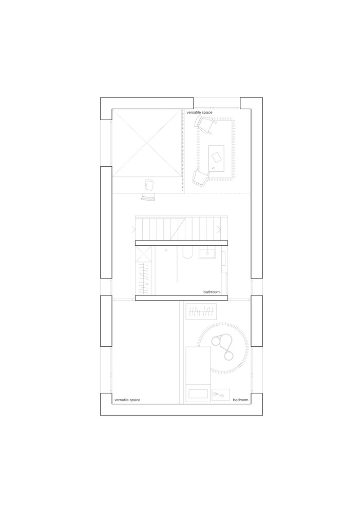 Upper floor plan drawing showing bedroom and bathroom spaces organized around a central stairwell