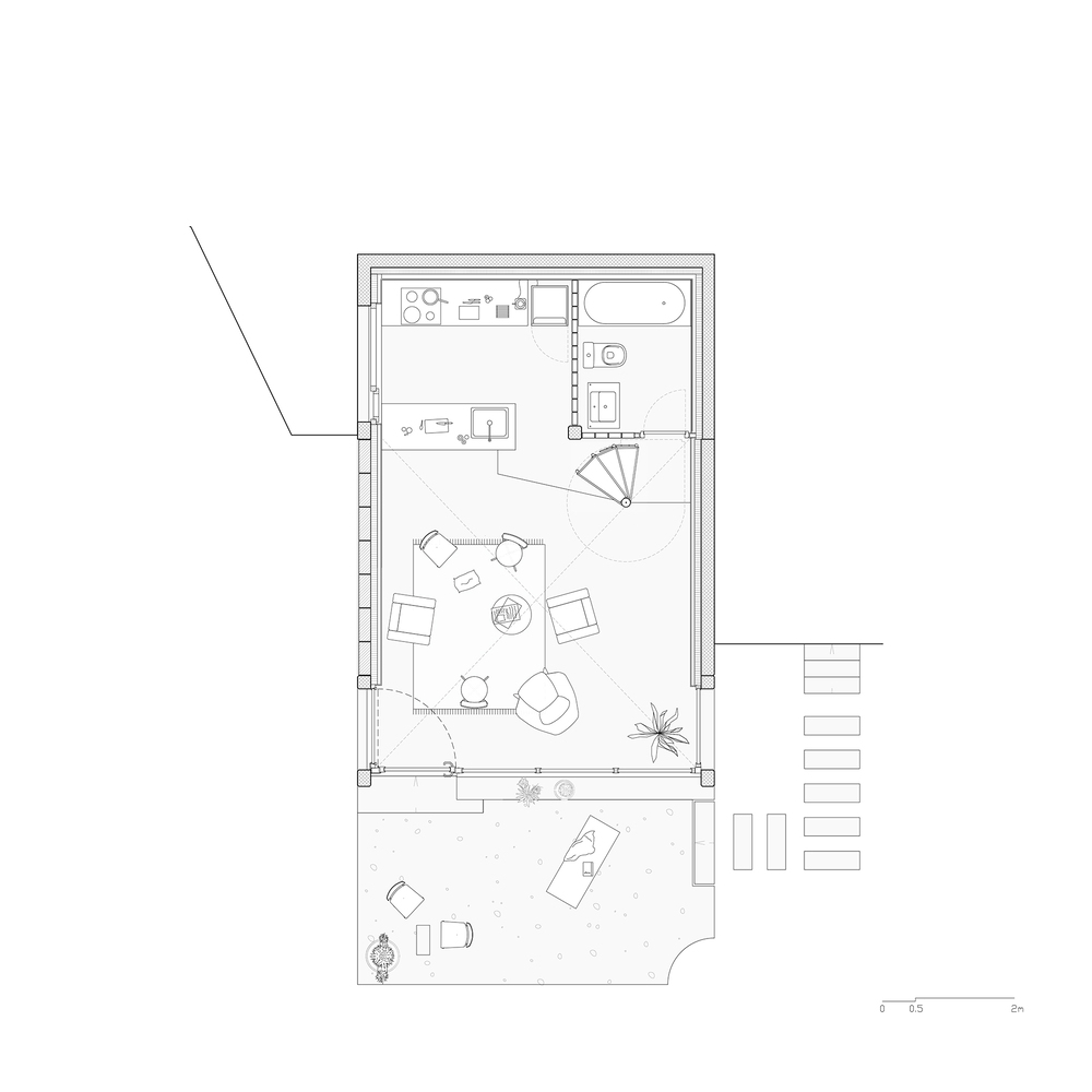 Floor plan drawing showing living area with spiral stair, kitchen, bathroom and attached terrace