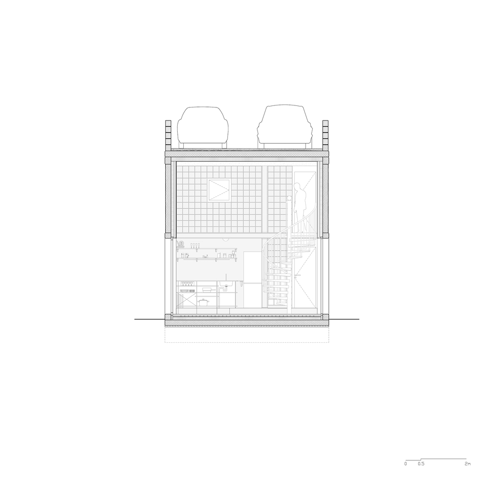 Section drawing showing two-level interior with gridded upper volume and two roof tanks above