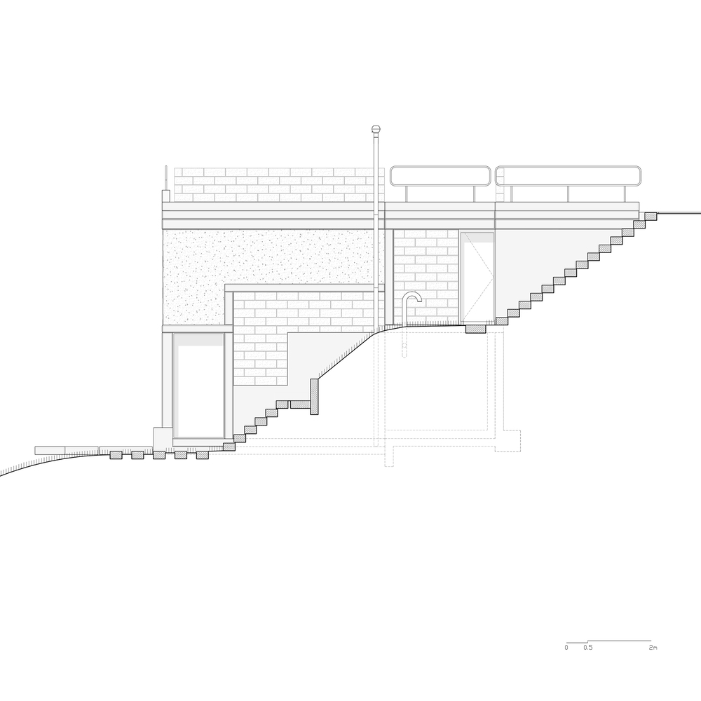 Section drawing revealing stepped interior floors with brick walls and exterior stairs