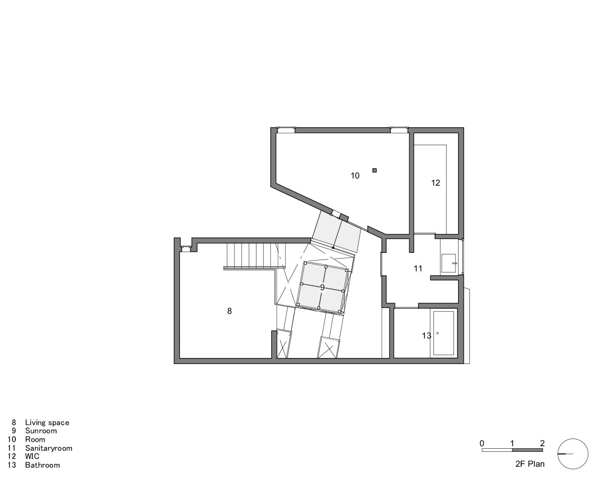 Second floor plan drawing showing living space, sunroom and central stairwell with angled geometry