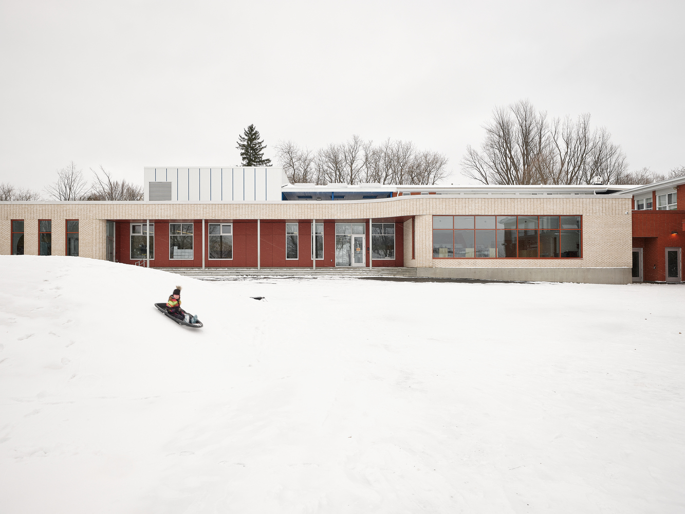 Louis-Saint-Laurent School expansion — new wings that speak fluently to a mid-century original