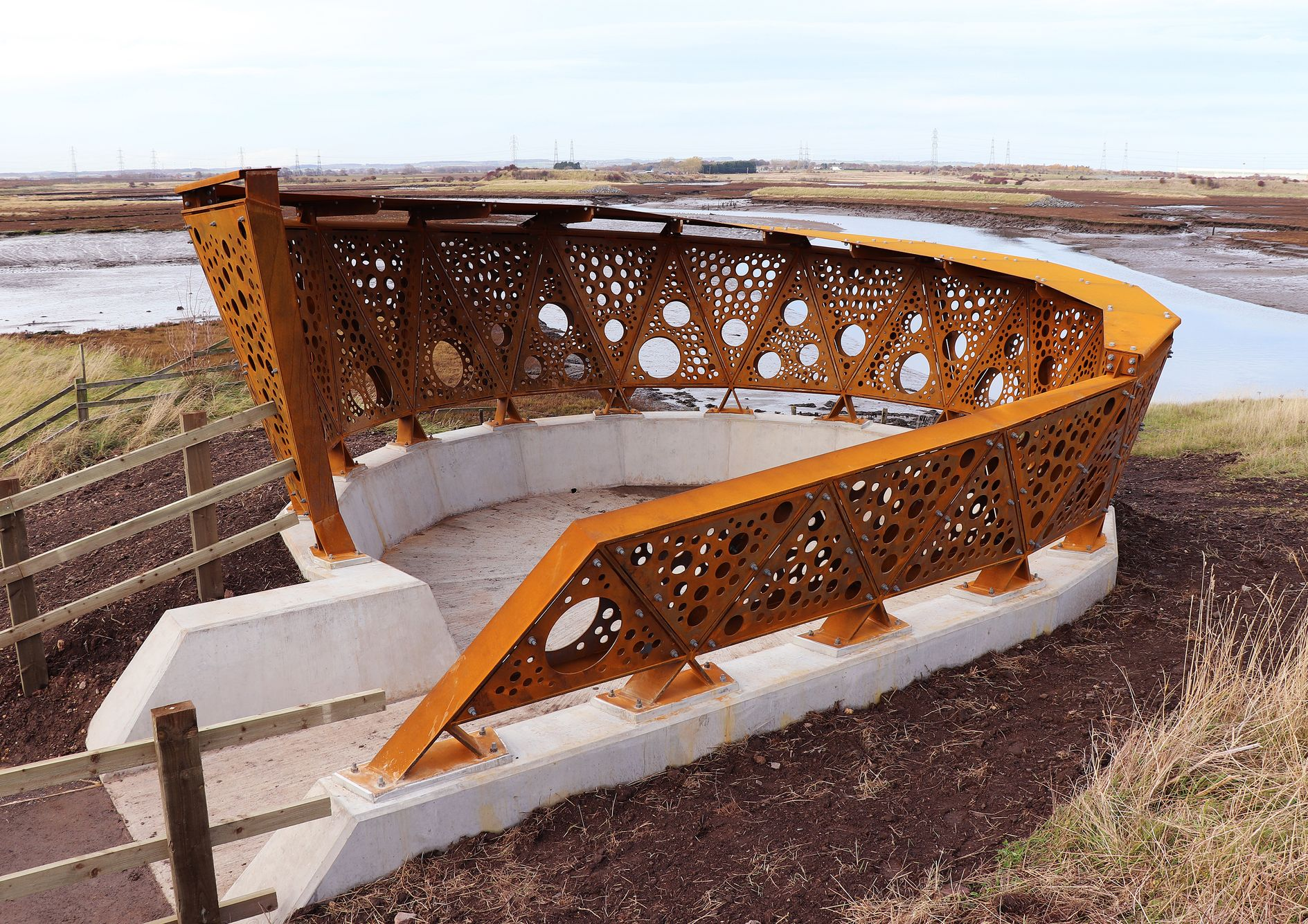 Greatham Creek Seal Hide – A striking fusion of perforated steel and concrete, designed for immersive wildlife observation and sustainability.
