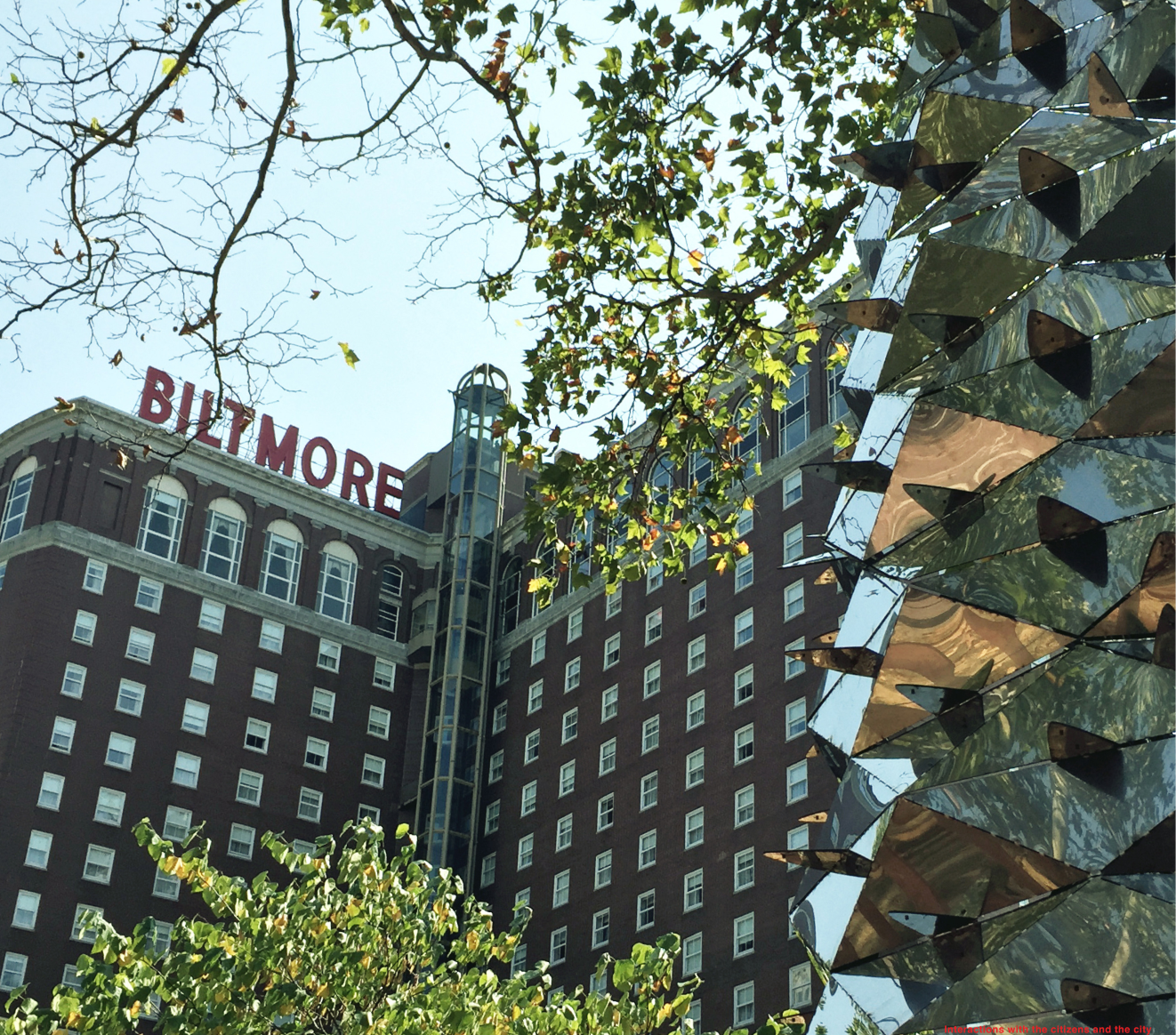 Urban Contrast – Mirrored surfaces reflecting the historic Biltmore Hotel and surrounding nature.