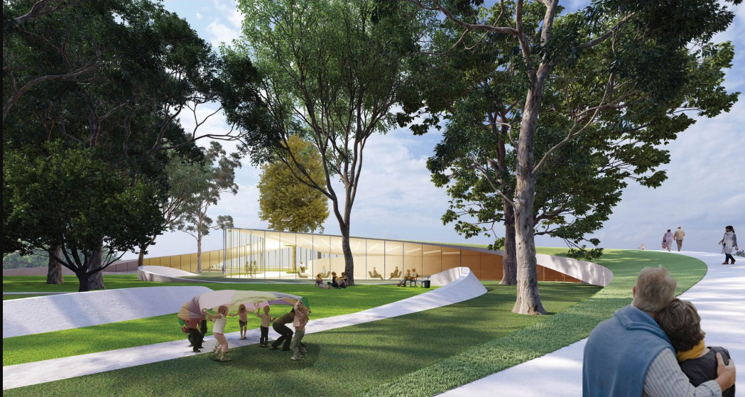 Gentle green slopes curve around the building, inviting all ages to engage with nature and each other.