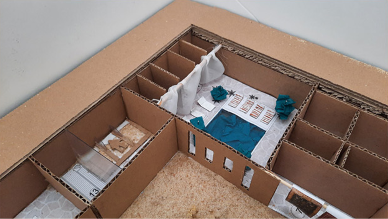 Cardboard study model showcasing spa layout and therapeutic treatment areas.
