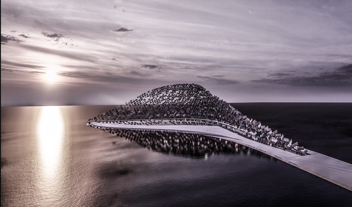 Aerial view of the arched structure extending over water at sunset with calm seas