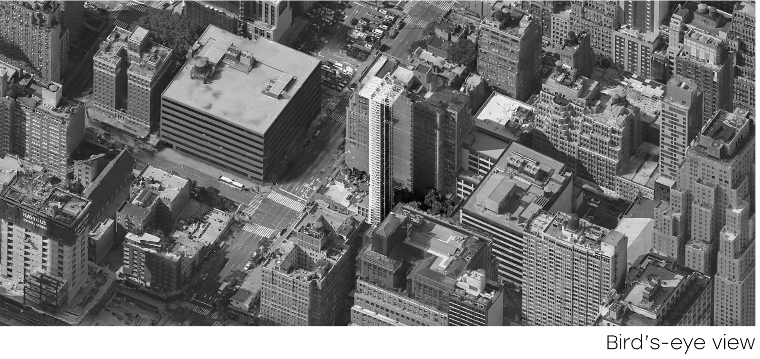 Oblique aerial showing the tower's ribbed facade rising from the dense urban grid