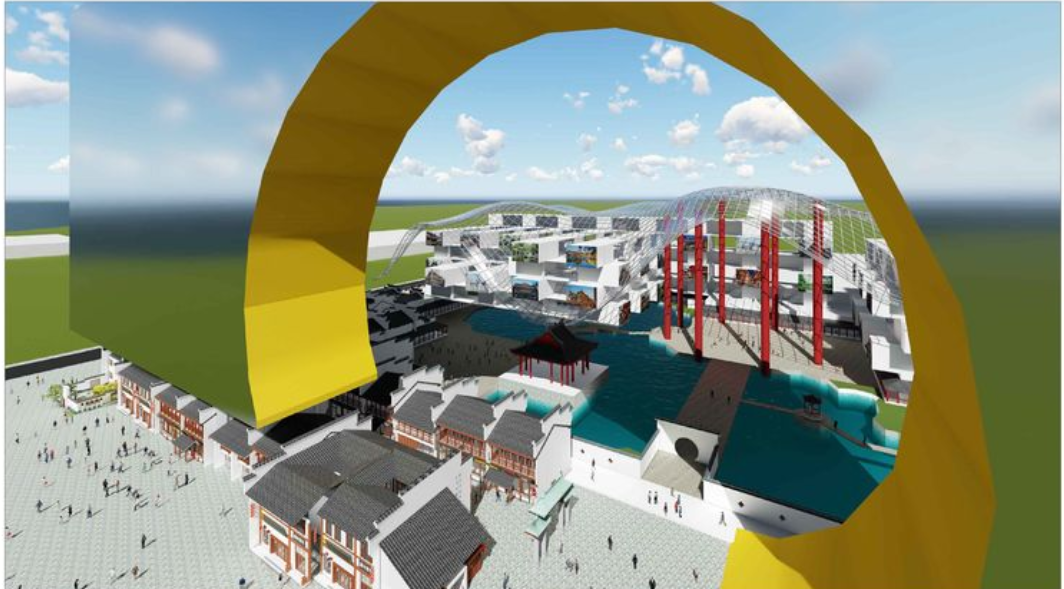 Aerial view through the golden ring showing low-rise buildings and the gridshell structure beyond the water