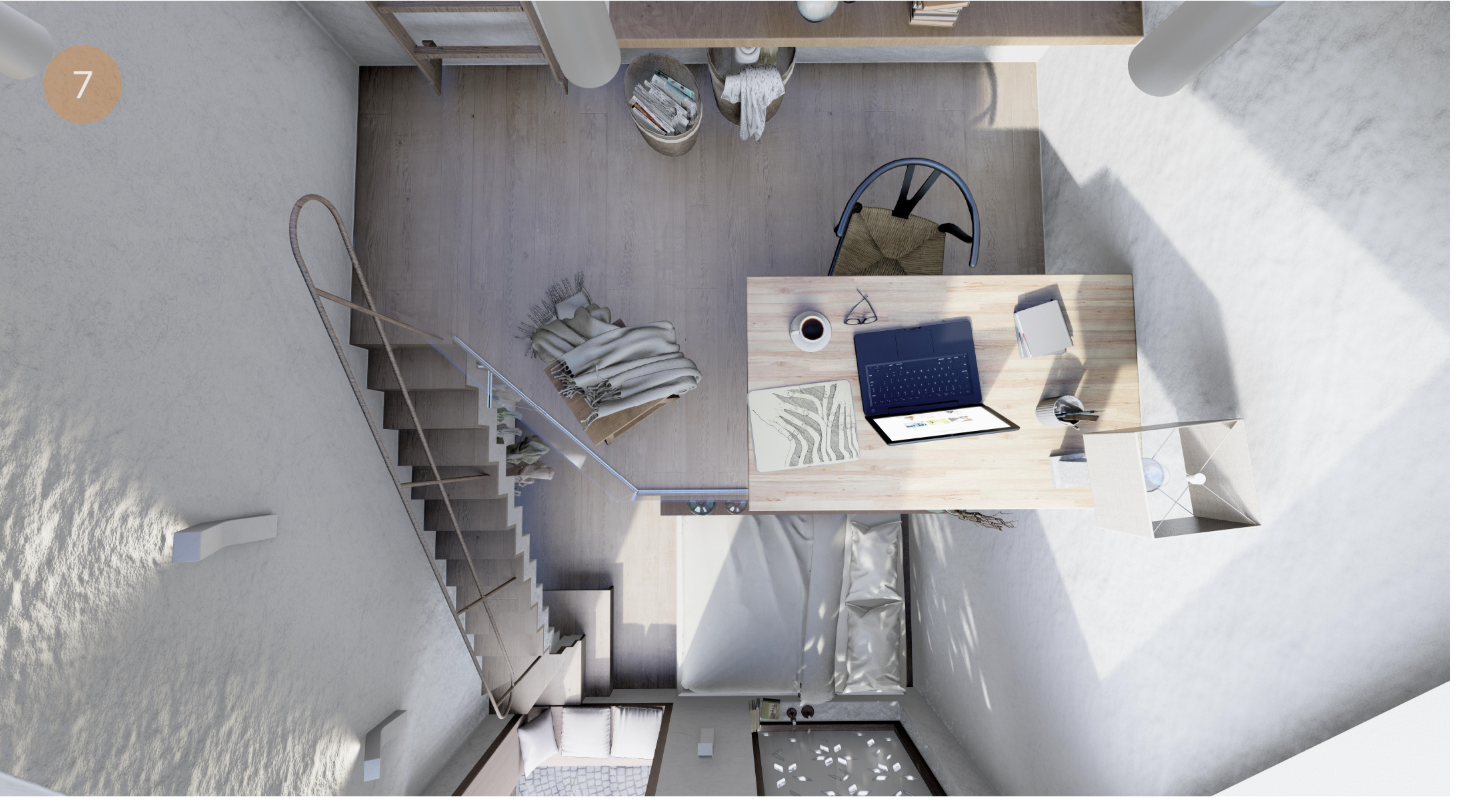 Top-down view of a compact loft interior with steel staircase, light wood desk, and built-in furniture