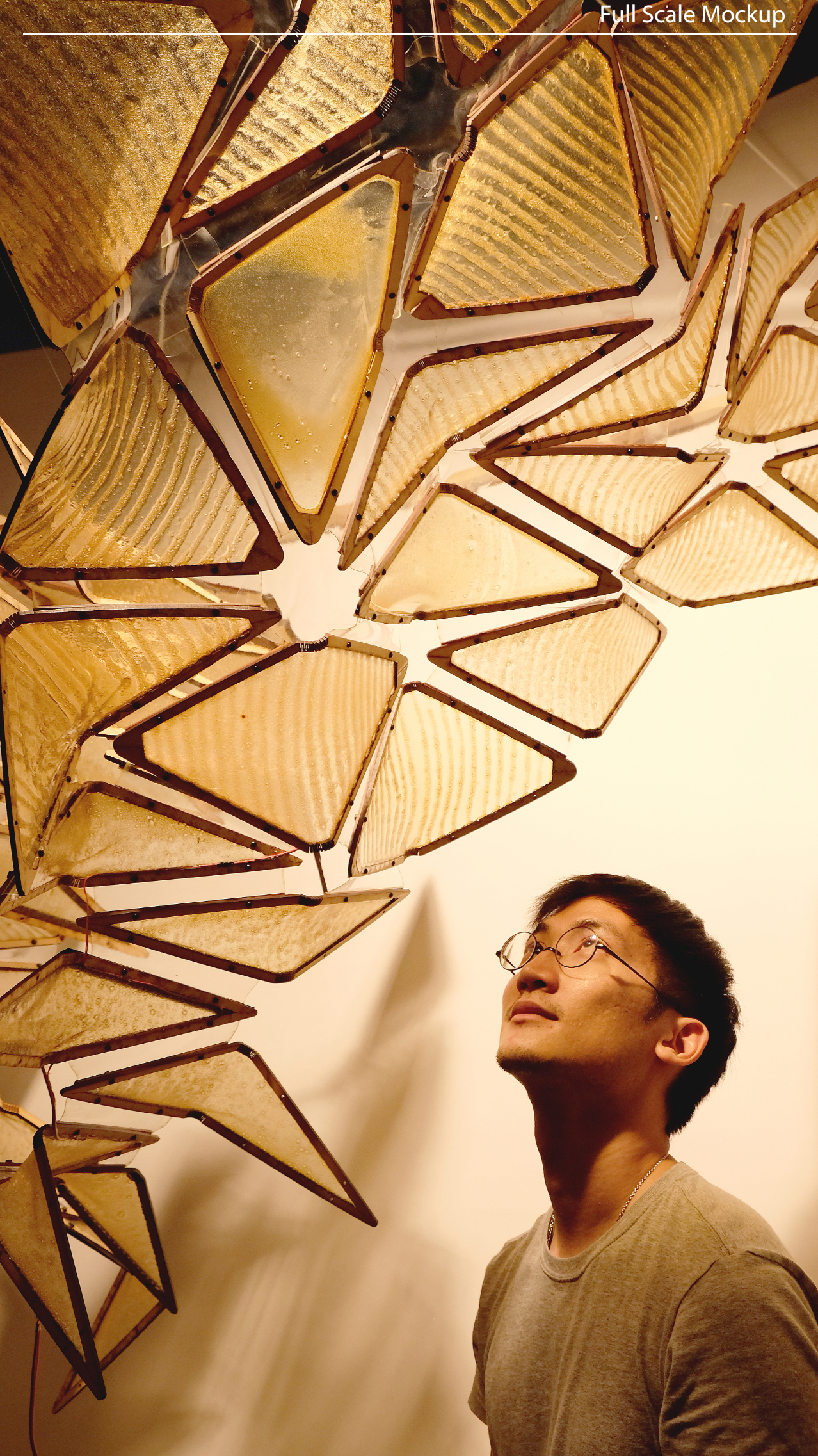 A student observes the modular chitosan installation up close.