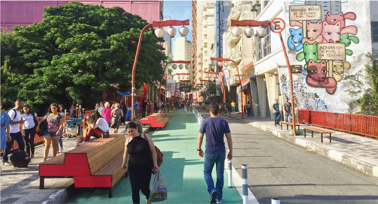 Transforming car-dominated space into a vibrant urban corridor with seating and community interaction.