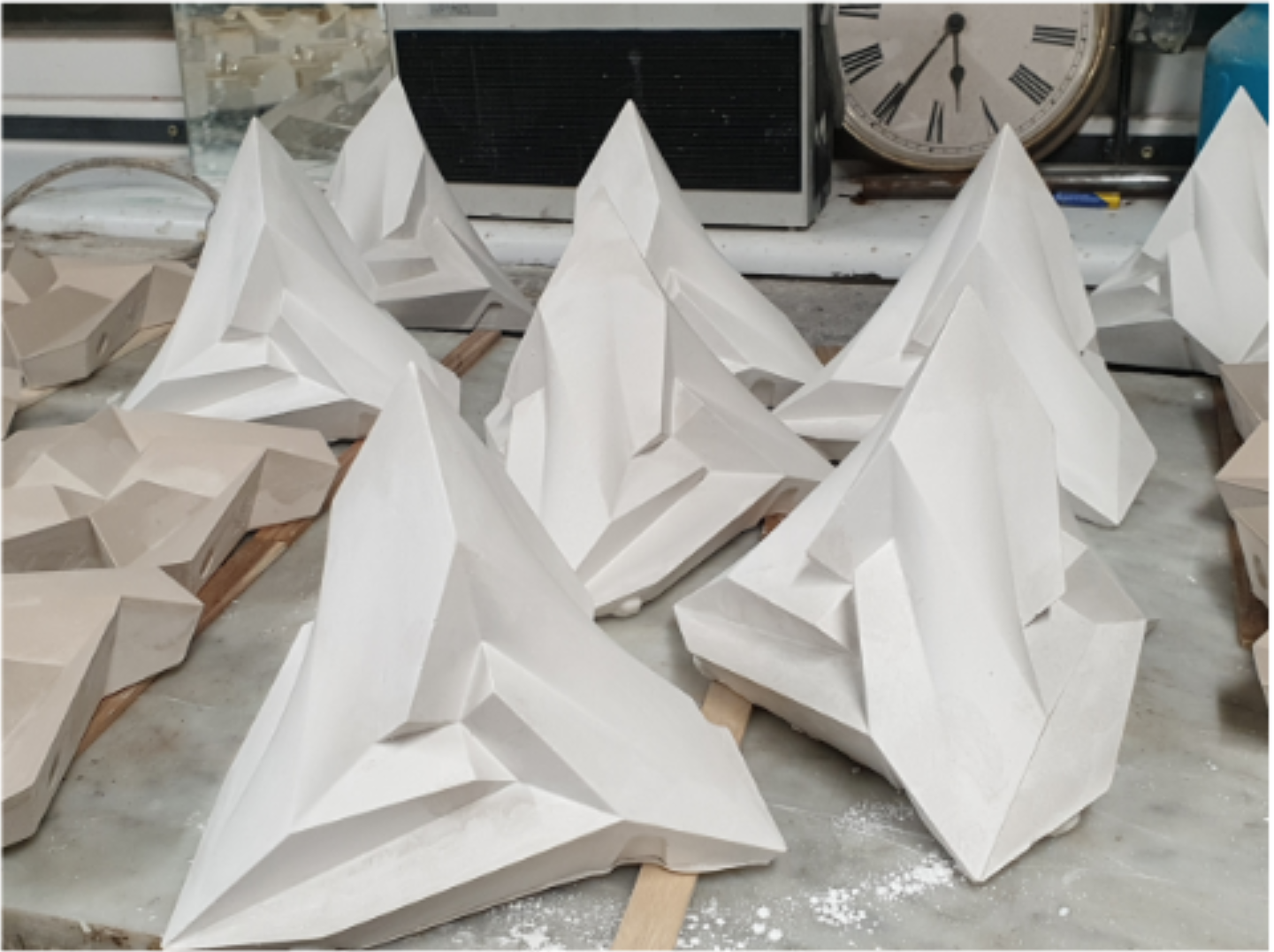 Plaster casts of the Stella Octangula polyhedron drying after molding.