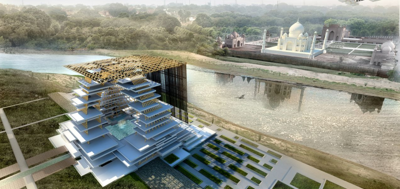 Aerial view of the layered horizontal platforms with lattice canopy beside a reflecting pool and distant monument