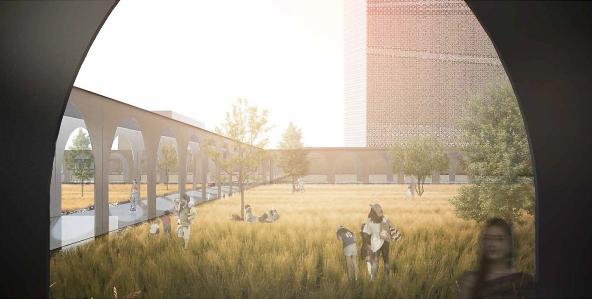 View through arched opening onto grassy courtyard with colonnade and perforated brick tower in hazy sunlight