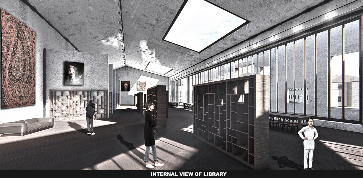 A light-filled reading space with skylights and contemporary shelving, designed to inspire reflection, learning, and cultural connection.
