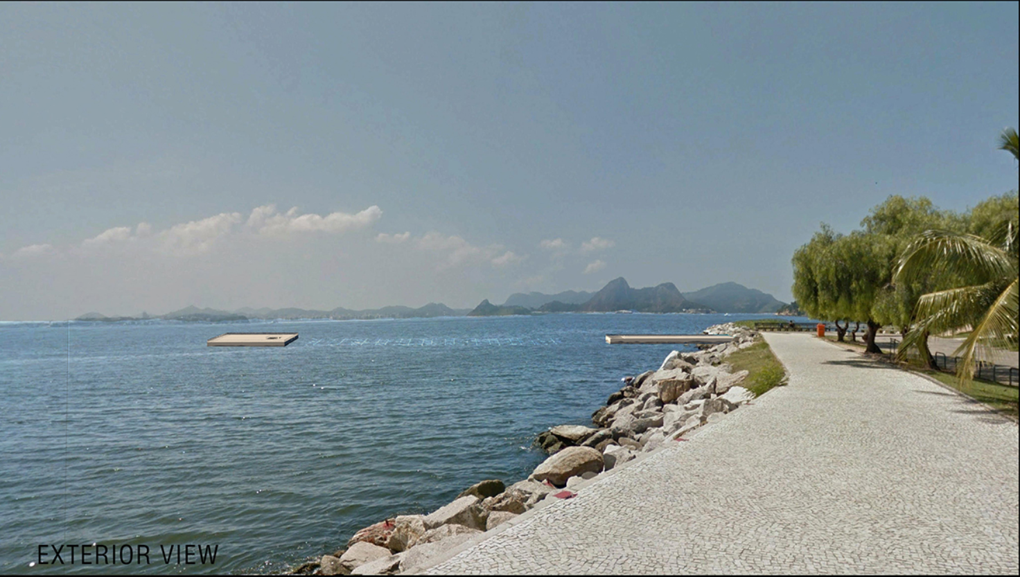 Coastal perspective capturing the Athenaeum’s discreet footprint emerging from the ocean surface.