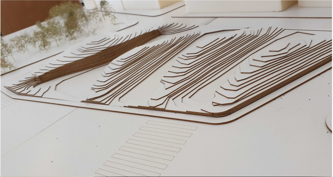 Topographic layering illustrating how built form emerges seamlessly from the terrain.